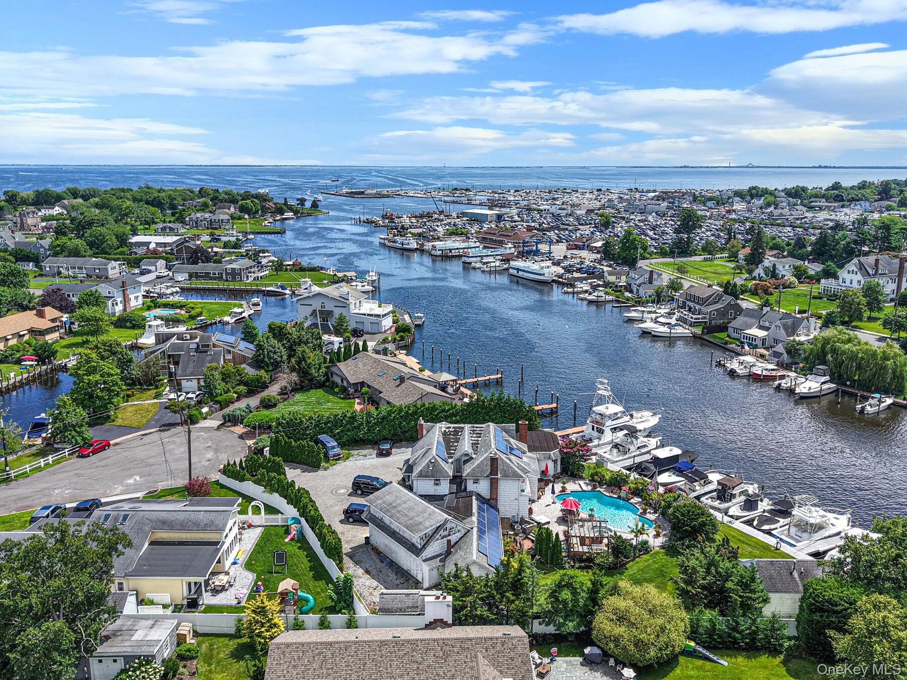 Aerial of 64 Mowbray Avenue, Bay Shore — the Penataquit Canal running to the Great South Bay